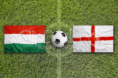 Hungary vs. England flags on soccer field