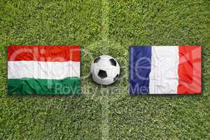 Hungary vs. France flags on soccer field