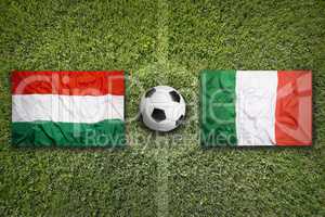 Hungary vs. Italy flags on soccer field