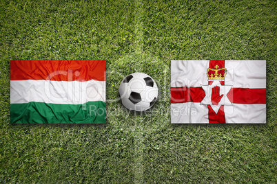 Hungary vs. Northern Ireland flags on soccer field