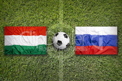 Hungary vs. Russia flags on soccer field