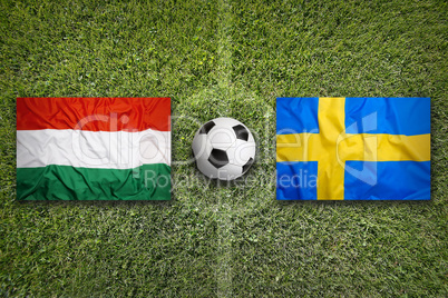 Hungary vs. Sweden flags on soccer field