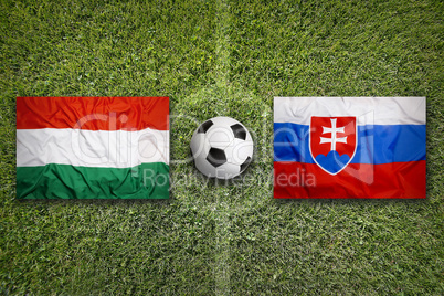 Hungary vs. Slovakia flags on soccer field
