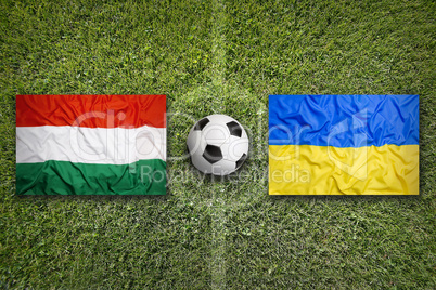 Hungary vs. Ukraine flags on soccer field