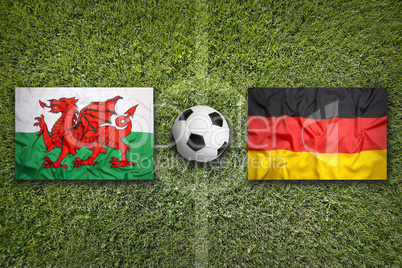Wales vs. Germany flags on soccer field
