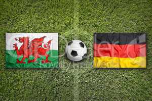Wales vs. Germany flags on soccer field