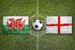 Wales vs. England flags on soccer field