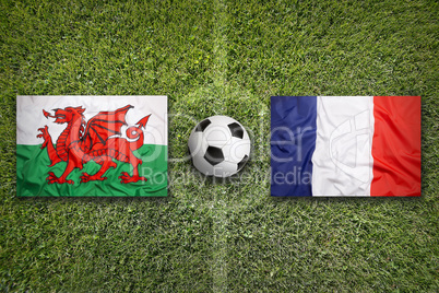 Wales vs. France flags on soccer field