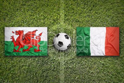 Wales vs. Italy flags on soccer field