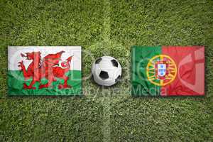 Wales vs. Portugal flags on soccer field