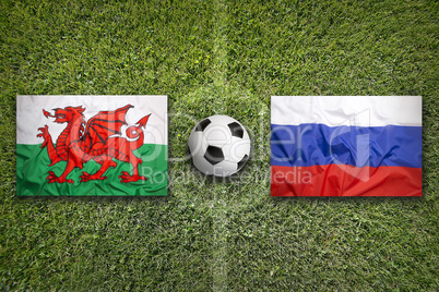 Wales vs. Russia flags on soccer field