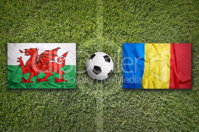 Wales vs. Romania flags on soccer field