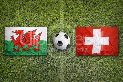 Wales vs. Switzerland flags on soccer field