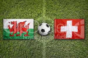 Wales vs. Switzerland flags on soccer field