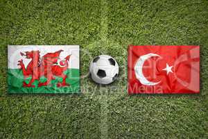 Wales vs. Turkey flags on soccer field