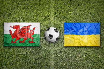 Wales vs. Ukraine flags on soccer field