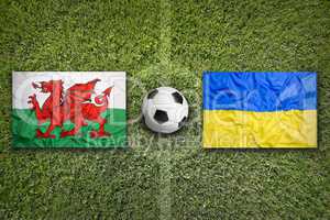 Wales vs. Ukraine flags on soccer field