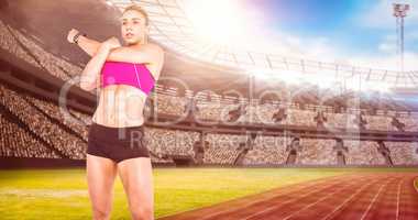 Composite image of female athlete stretching and listening music