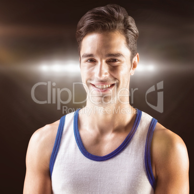 Composite image of portrait of happy athlete on black background