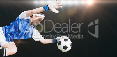 Composite image of woman goalkeeper stopping a goal