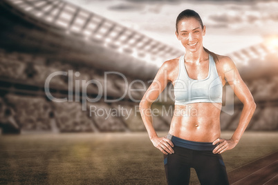 Composite image of sporty woman posing and smiling