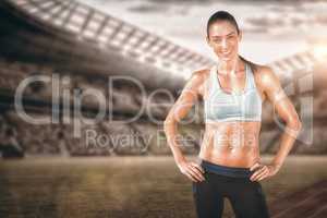 Composite image of sporty woman posing and smiling