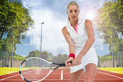 Composite image of athlete playing tennis with a racket