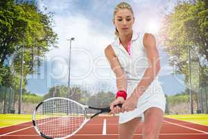 Composite image of athlete playing tennis with a racket