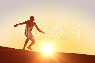 Composite image of athlete man throwing a discus
