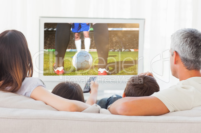 Composite image of family sitting on sofa watching television to