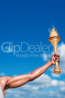 Composite image of front view of happy sportsman holding a cup