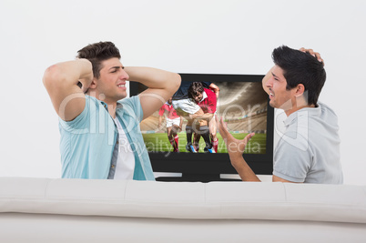 Composite image of disappointed soccer fans watching tv