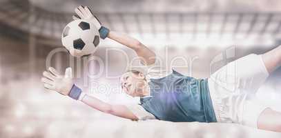 Composite image of woman goalkeeper stopping a goal