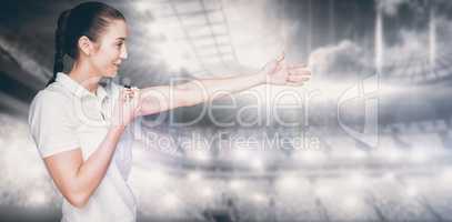 Composite image of female athlete blowing a whistle and pointing