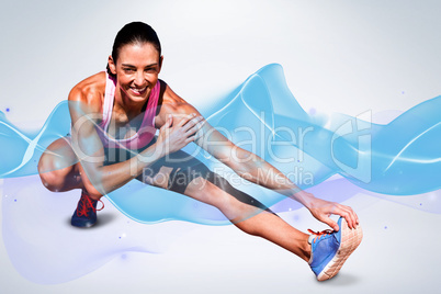 Composite image of portrait of happy sportswoman is stretching h