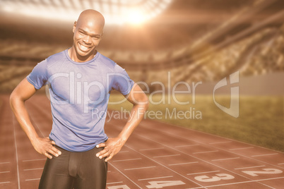 Composite image of sportsman smiling and posing on a white backg