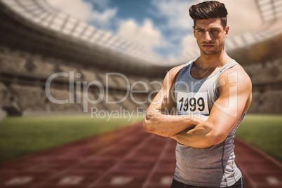 Composite image of portrait of handsome sportsman is posing with