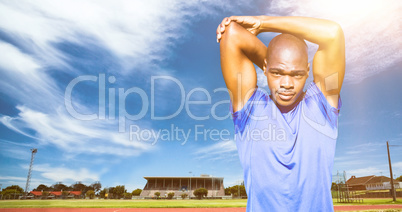 Composite image of athletic man stretching his arms