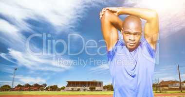 Composite image of athletic man stretching his arms
