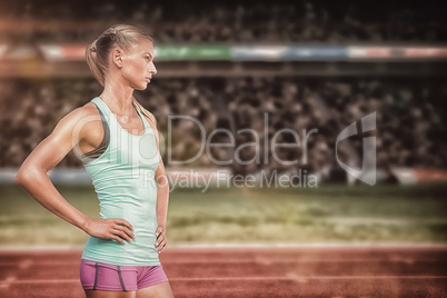 Composite image of profile view of sportswoman standing on a whi