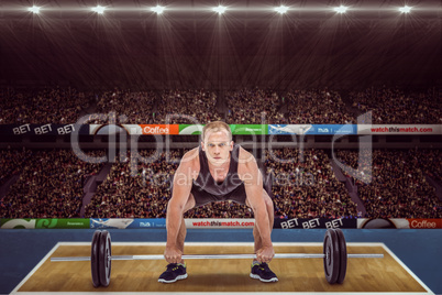 Composite image of bodybuilder lifting heavy barbell weights