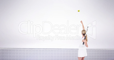 Composite image of athlete holding a tennis racquet ready to serve