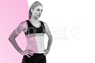 Composite image of female athlete standing with hand on hip