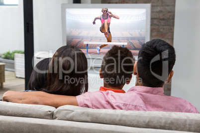 Composite image of athletic woman practicing show jumping