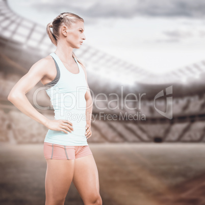 Composite image of profile view of sportswoman standing on a whi