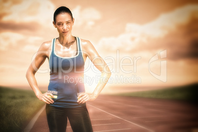 Composite image of sportswoman posing on a white background