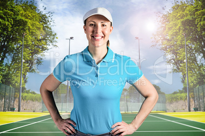 Composite image of sportswoman posing on black background