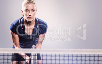 Composite image of tennis player playing tennis with a racket