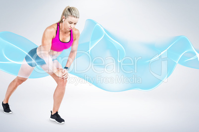 Composite image of female athlete stretching and listening music