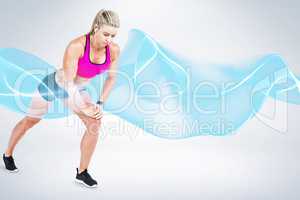 Composite image of female athlete stretching and listening music